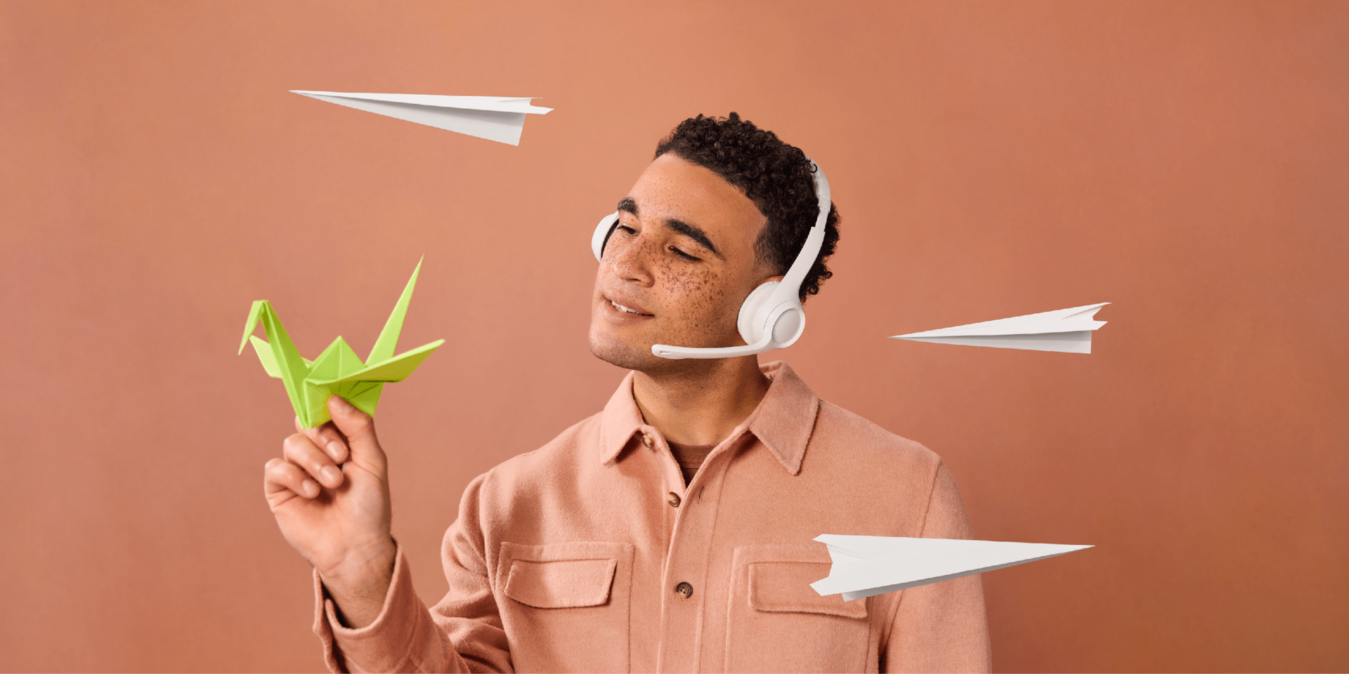A support agent holding an origami bird, showing how AI is changing customer expectations.